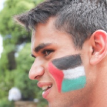 A supporter of the pro- Palestinian cause wears the Palestinian flag on his cheek. Photo: Nqobile Dludla