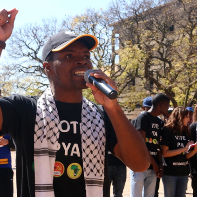 TRIED & TESTED: Progressive Youth Alliance (PYA) candidate Mcebo Dlamini tries to convince students to vote for the “very same leadership that has been with you through thick and thin”. Dlamini was addressing a crowd of students at the lunch circus held outside the Wits Great Hall. Photo: Nqobile Dludla.